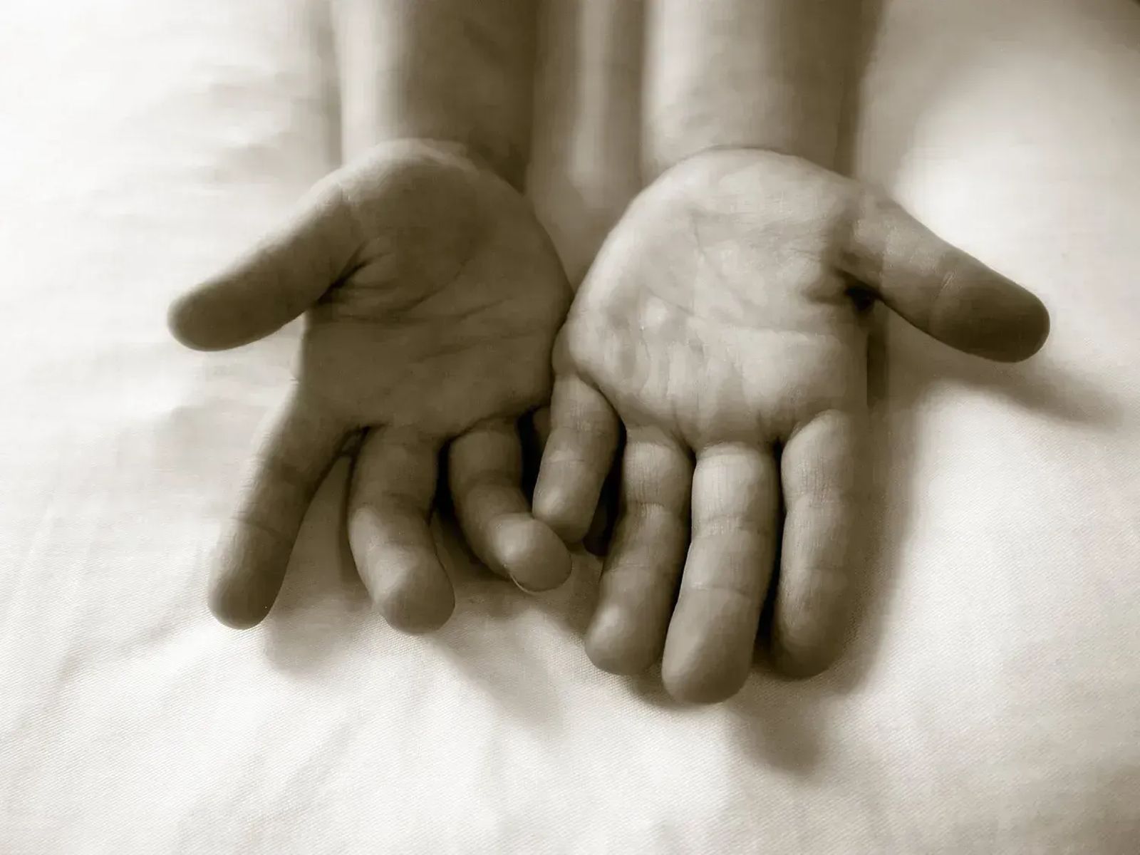 Infant hands held open