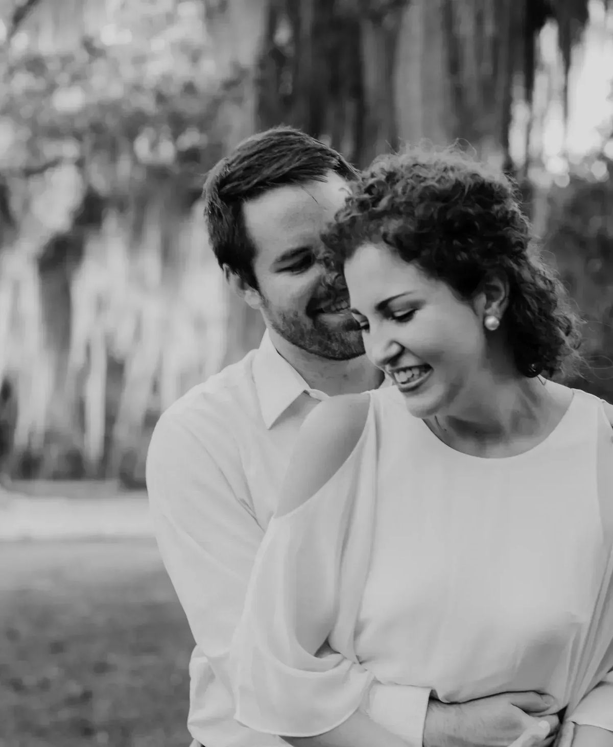 Kara and Robert in a black and white photo holding each other close